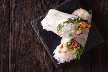 Delicious vietnamese spring roll with vegetable on dark background ,healthy food