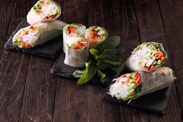 Delicious vietnamese spring roll with vegetable on dark background ,healthy food