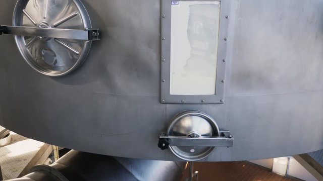 Powdered milk processing line. Interior of milk factory. Industrial workshop at factory. Camera movement bottom to top