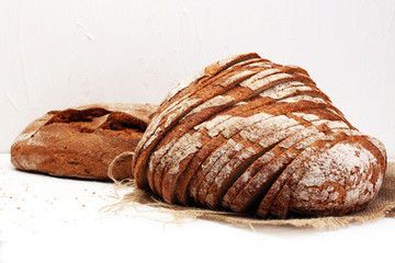 Different kinds of bread on board from above. Kitchen or bakery poster design.