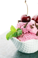 Homemade cherry ice cream on table with fresh cherries