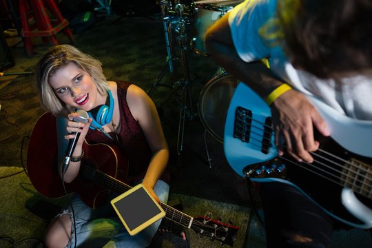 Female singer singing on vintage microphone