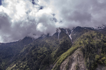Mountain surrounded by cloud at dawn landscape in Shangri La, Yunnan Province, China