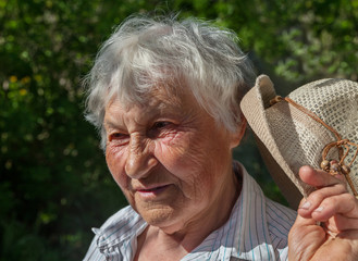 Older woman with hat.