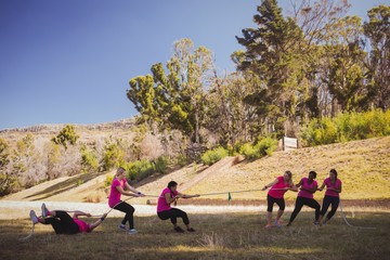 Group of women playing tug of war 