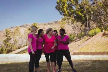 Group of women interacting with each other in the boot camp