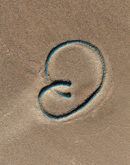 Fototapeta na wymiar Figures on a sand.