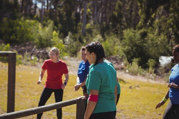 Fit women training on fitness trail in the boot camp