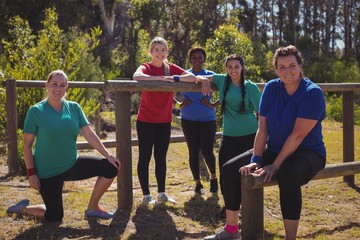 Group of fit women relaxing together in the boot camp