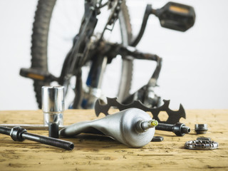 Mountain bike with spare parts in the garage.