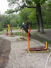 Exercise equipment in the public park. Spring day