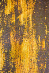 yellow withered paint on rusty metal grunge texture
