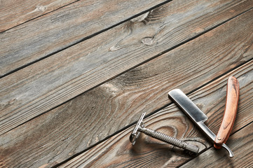 Vintage barber shop tools on wooden background