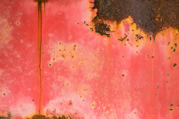 red withered paint on rusty metal grunge texture