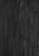 Black, rustic, rough wooden slats, dark abstract background of hard wood