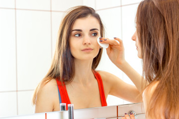 pretty young woman doing make up