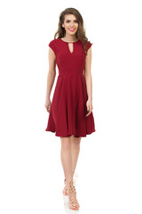 Young Woman In Elegant Burgundy Dress Is Walking