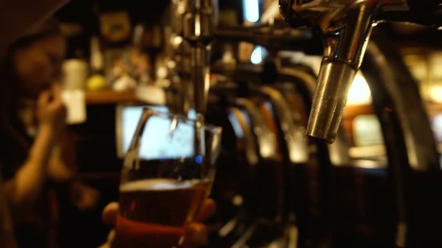 Barman Pouring Beer at Pub