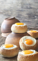 Egg-in-a-hole buns on the wooden board