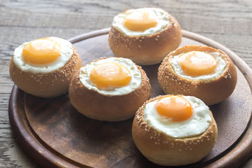 Egg-in-a-hole buns on the wooden board