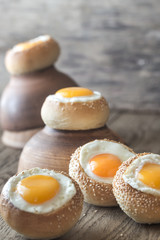 Egg-in-a-hole buns on the wooden board