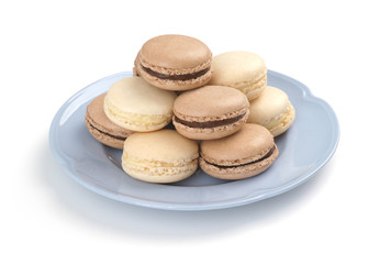 Chocolate and Vanilla Macarons on Blue Plate with White Background