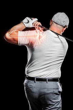 Golfer Playing Against Black Background