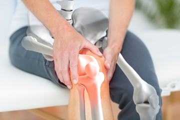 Man suffering with knee inflamation - obrazy, fototapety, plakaty