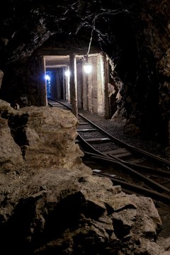 Old dark dangerous mine corridor