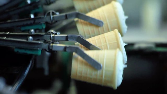 Ice cream production line. Food processing machinery. Dairy products manufacturing line. Industrial equipment at food factory. Automated production line. Modern food technology. Food industry