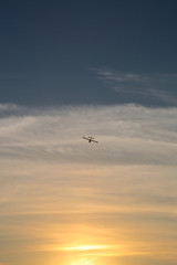Fototapeta premium Plane flying to the sun