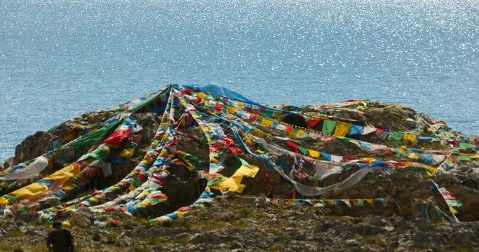 4k the lake namtso,tibet mansarovar,pray flag in wind,Tibet's second largest lake,is the third largest saltwater lake in China.Danggula(Tanggula) Mountains in xizang Plateau,roof of the World.