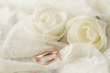 Wedding rings on lace background