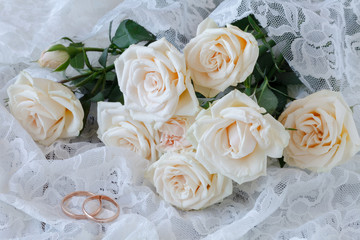 The rings on the flowers on a white fabric, wedding details