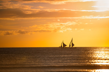 Sailing boats with a beautiful sunset
