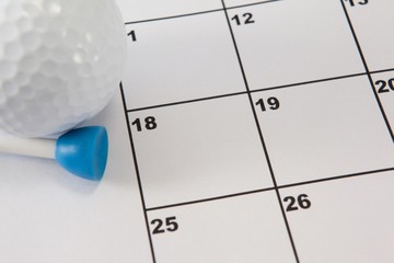 Golf ball and tee golf on calendar
