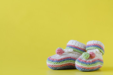Fototapeta na wymiar Baby Socks on yellow