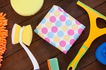 Various cleaning equipment arranged on wooden floor