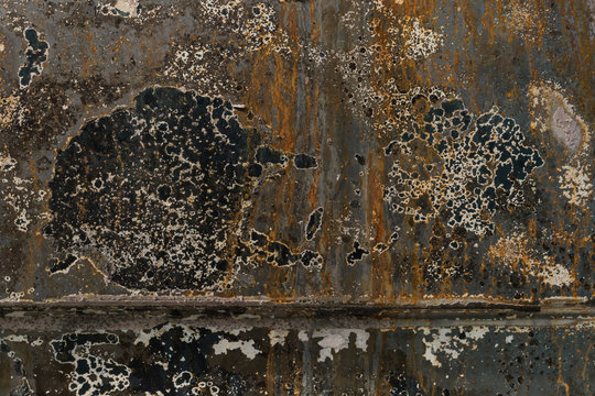 burnt corrugated lacquer orange blue colors on rusty metal surface