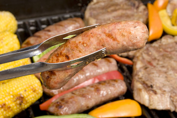 Barbecued bratwurst and steaks