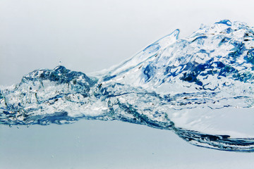 Water splash with bubbles of air, isolated on the white background