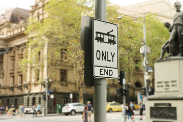 MELBOURNE, AUSTRALIA - March 15, 2017: A black and white Tram Only sign on the corner of Swanston and Collins Streets in Melbournes CBD