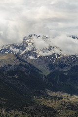 Naklejka premium Mountain landscape with pine trees and melitng snow