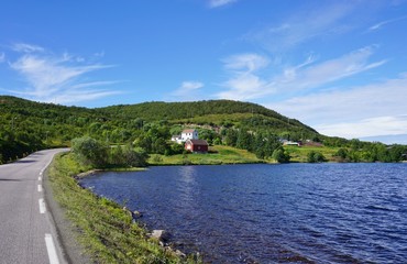 Driving on a road in the fjords in the Lofoten Islands, Norway