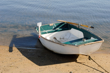 Naklejka premium Dingy sitting on beach in San Diego