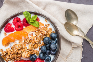 Yogurt with baked granola and berries
