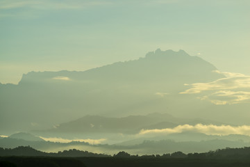 Beautiful sunrise over Mount Kinabalu and river Ganyang in Sabah, Malaysia. View point from Mengkabong bridge