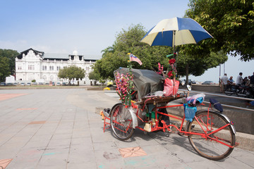 An old rickety trishaw  in Penang, Malaysia.