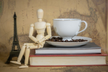 Cup  coffee on books