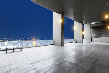empty floor with cityscape of tokyo at night